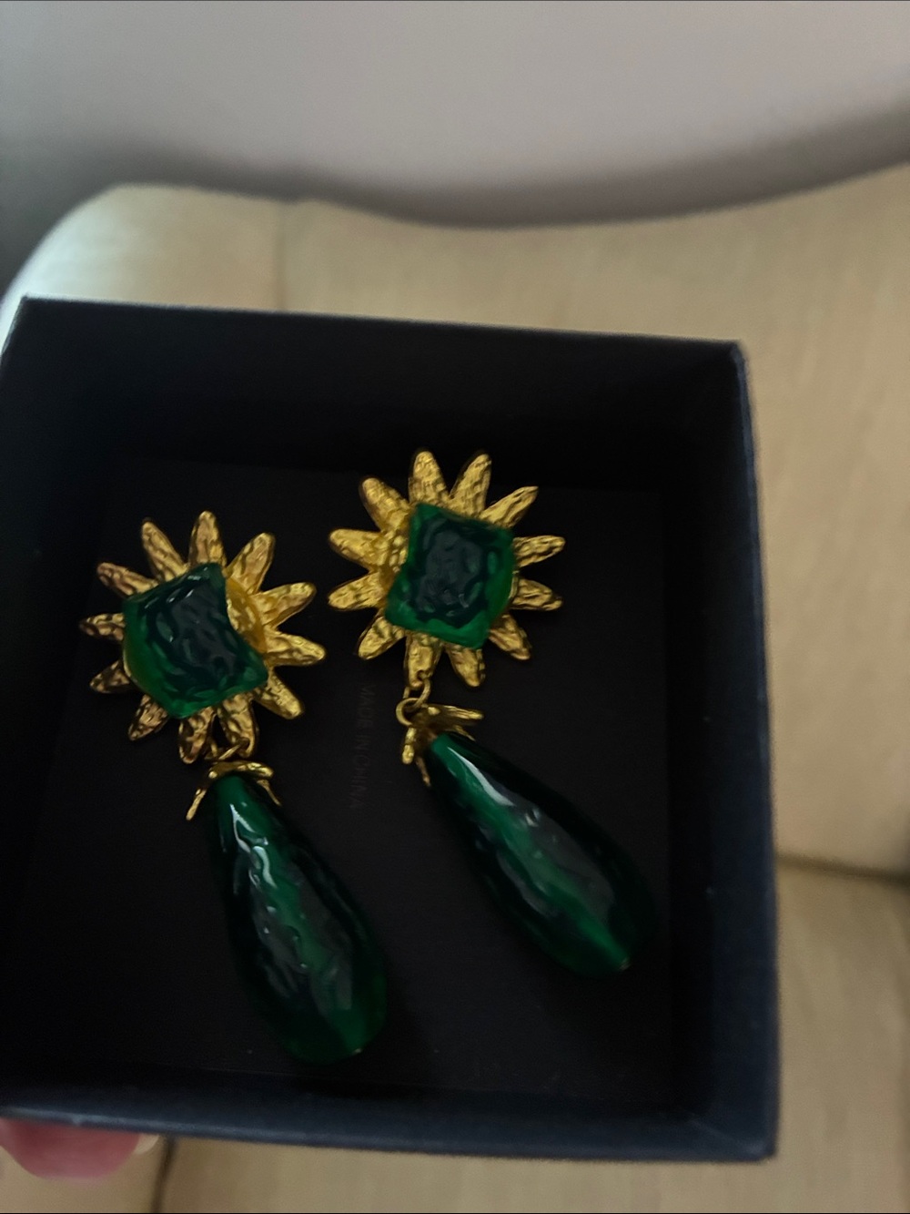 Green and gold tone earrings